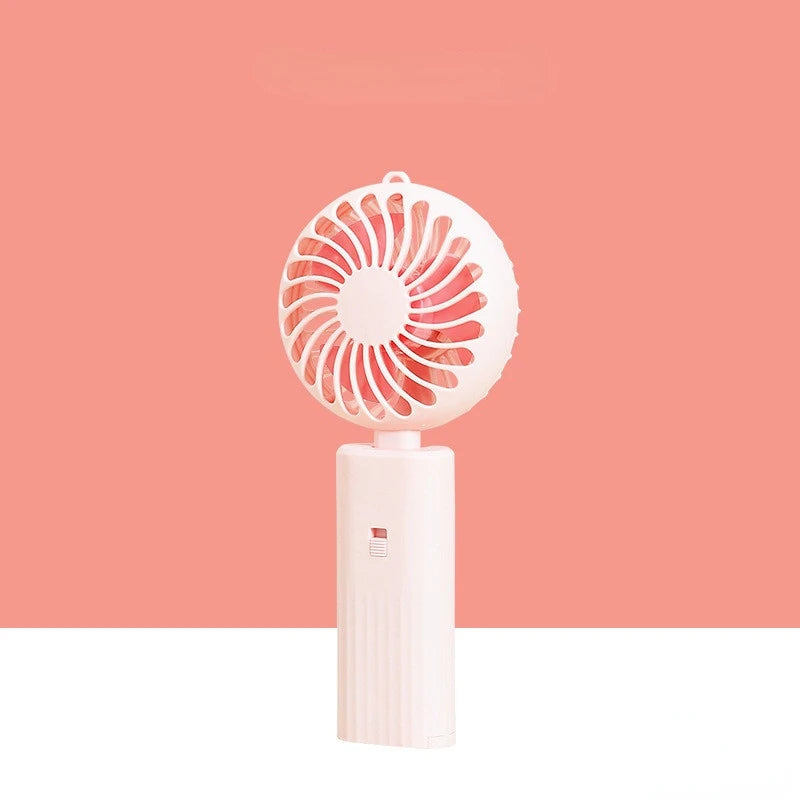 New foldable hand-held small fan Mini portable desktop fan Simple shape, strong wind speed, driven by two AA batteries - Stereotech