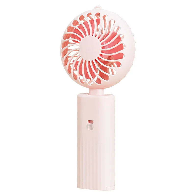 New foldable hand-held small fan Mini portable desktop fan Simple shape, strong wind speed, driven by two AA batteries - Stereotech